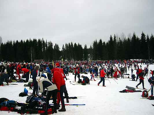 many people and many bags of equipment