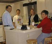 John, Bob, Dina, and Mary with wine and cheese